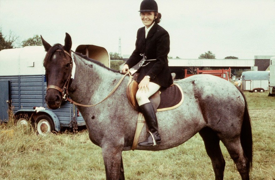 A Blue Roan with rider, mid-Summer coat