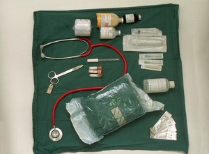 view Veterinary surgeon's home visit instruments laid out on green cloth