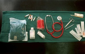 view Veterinary surgeon's home visit instruments laid out on green cloth