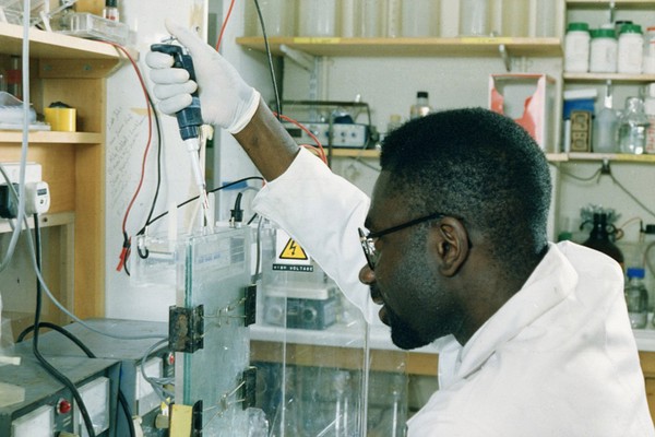 Scientist loading samples for electrophoresi