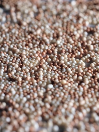 Spheres of medicine to be delivered in capsule form