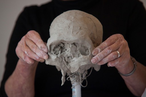 Human head sculpted in clay, forming the cheekbones