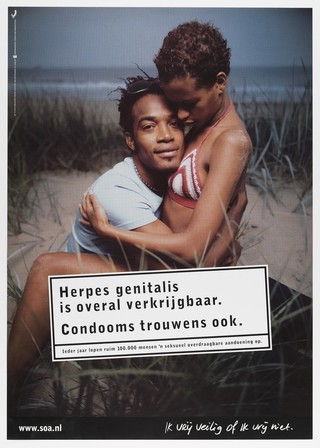 A young black man and woman embracing on sand dunes, in need of condoms to avoid herpes infection. Colour lithograph for Stichting SOA-bestrijding, ca. 1999.