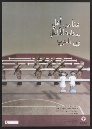 Military figures behind two children as figures on a table football game, representing the International Committee of the Red Cross in Egypt. Colour lithograph by Creco Adv., ca. 2000.