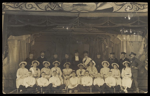 Men on a large stage set. Photographic postcard. 191- - 192-.