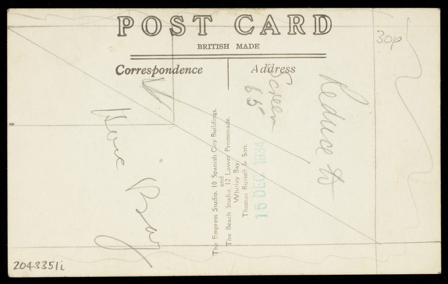 A young man in elaborate drag sits in front of a painted sky backdrop. Photographic postcard, 1934.