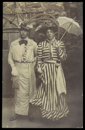 Two amateur actors in drag, wearing elaborate costume. Photographic postcard, 191-.