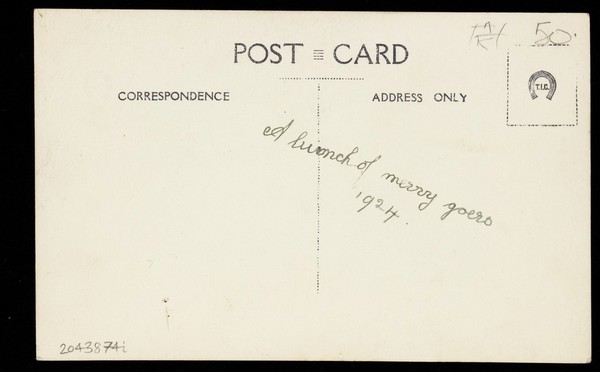 People gathered outside a building wearing various costumes, some in drag. Photographic postcard, 1924.