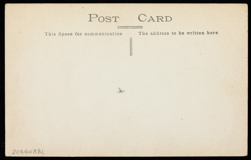 German prisoners of war, one in drag, propose a toast during a performance at Leigh prisoner of war camp, Lancashire. Photographic postcard by H. Attenborough, 191-.