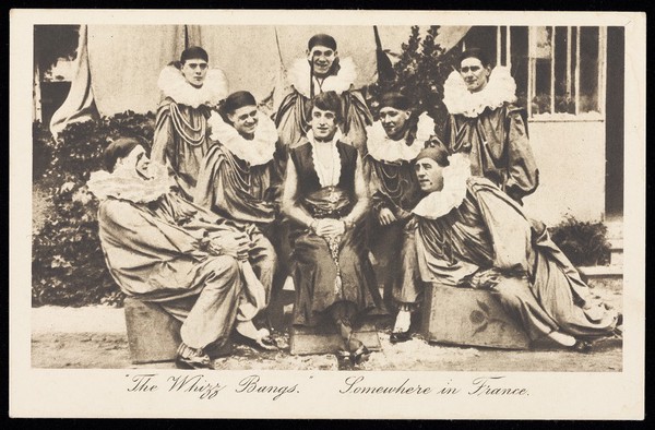 British soldiers in a concert party, one in drag, pose as "The Whizz Bangs". Postcard, 191-.