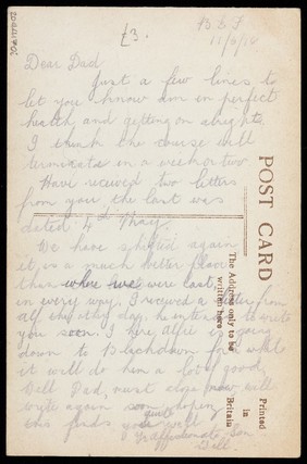 Soldiers, one in drag, performing in the concert party "The Goods". Photographic postcard, 1918.