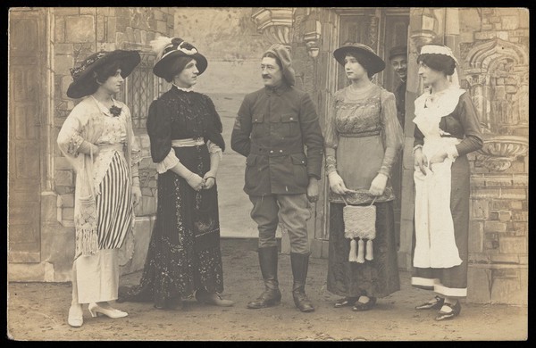 Prisoners of war performing a play at a prisoner of war camp in Cottbus. Photographic postcard, 191-.