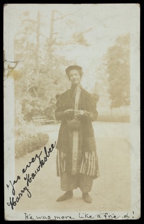 Harry Hawksbee wearing a large coat and bonnet.