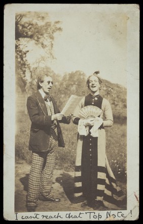 Harry Hawksbee rehearsing a song with a man wearing sunglasses.