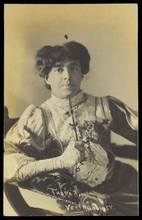 A ventriloquist in drag, known as "Thora ?". Photographic postcard, 191-.