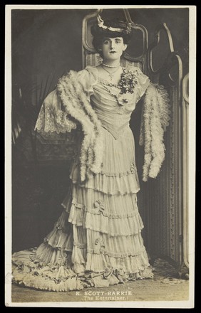 K. Scott-Barrie in character as "The entertainer". Photographic postcard, 191-.