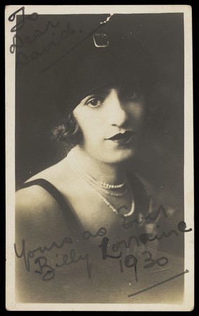 Billy Lorraine in drag, posing for a portrait. Photographic postcard, ca. 1930.