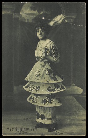 An actor poses on stage as "Sulmary".