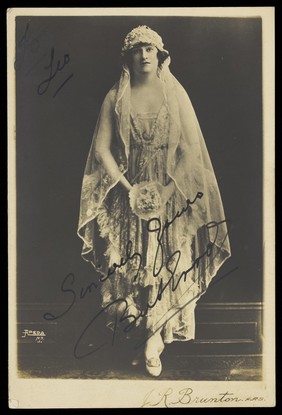 Bert Errol, in drag, dressed as a bride. Photographic postcard by Apeda, 192-.