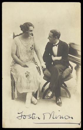 Foster and Ninon in character, having a conversation. Photographic postcard, 192- (?).