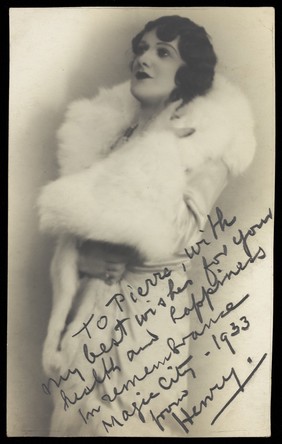 Henry, a man in drag, wearing a white fur stole. Photograph, 1933.