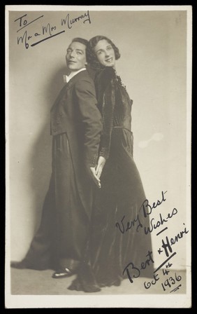 Bert and Henri, in character; wearing evening dress, one of them in drag. Photographic postcard, 1936.