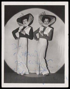 Alan Haynes and Terry Gardener performing in drag in their revue 'Why go to Paris". Photograph, 1950.