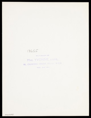 An actor in drag, performing on stage. Photograph by Mme Yvonne, 194-.