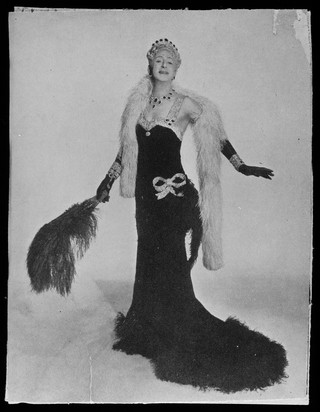 Douglas Byng in drag as a glamorous woman. Photograph, 194-.