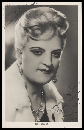 Bert Ward in drag as a glamorous woman. Photographic postcard, 1947.