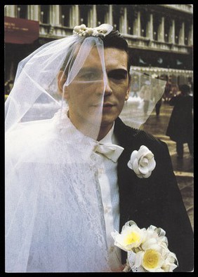 A man dressed as half bride, half groom. Colour process print after D. Gariboldi, 1986.