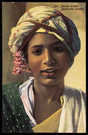 Photograph of an Arab boy smiling at the viewer, North Africa.