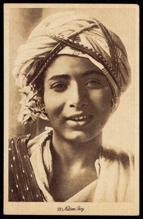 Photograph of an Arab boy smiling towards the viewer, Egypt.