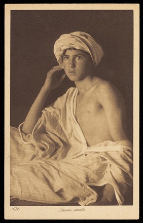 Photograph of an Arab boy looking towards the viewer, North Africa.