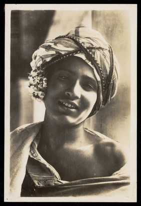 Photograph of an Arab boy smiling towards the viewer, Egypt.