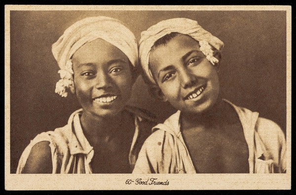 Two boys wearing pale garments. Process print, 193-.