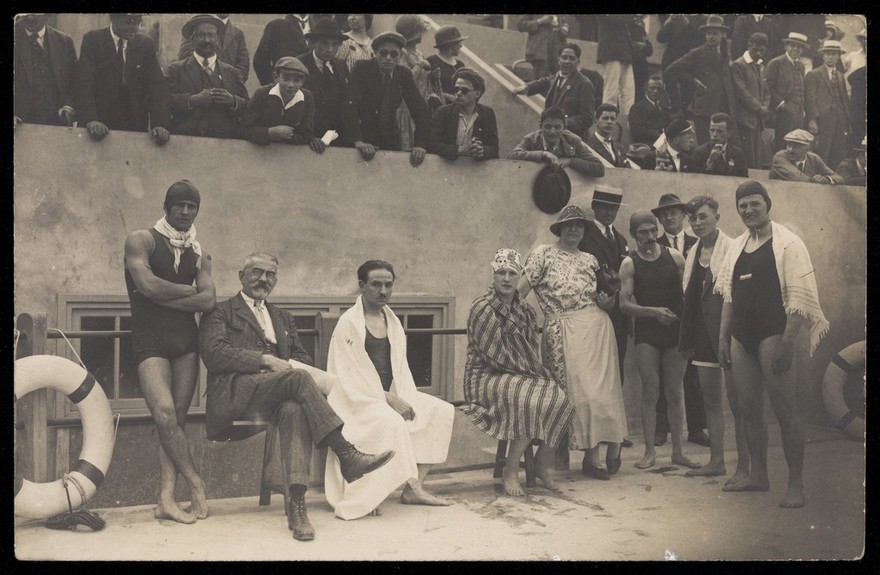 Swimmers, officials and spectators at the Paris Olympics. Photographic postcard by A. Pétin, 1924.