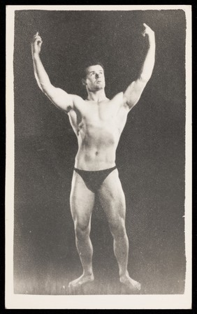 An athletic man poses in dark briefs. Process print, 195-.