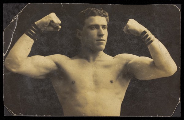 A wrestler flexing his biceps.