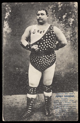 Josef Soukup, a weight-lifter, wearing a studded leotard and medals. Process print, 191-.