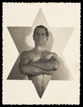 A wrestler inset centrally in a six-pointed star. Photographic postcard, 19--.