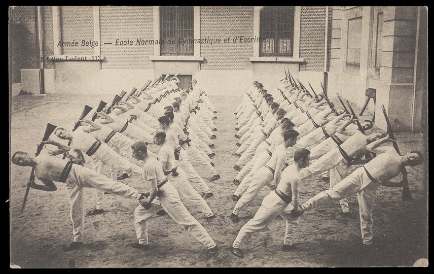 Ecole Normale de Gymnastique et d'Escrime, Joinville, Val-de-Marne: Belgian soldiers performing gymnastic exercises with rifles. Process print, 190-.