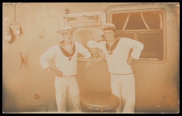Two sailors posing on the deck of a boat. Photographic postcard, 191-.