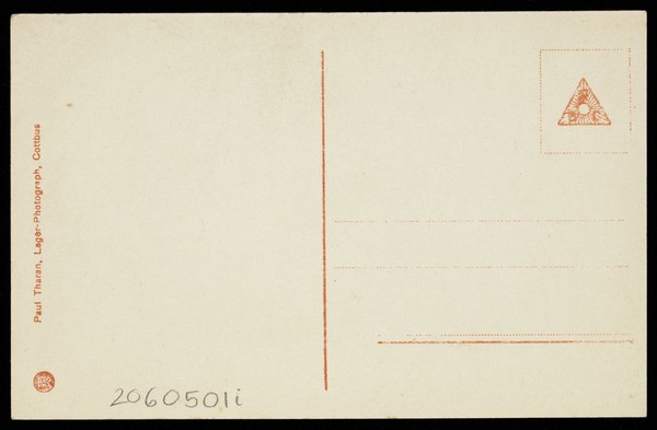 An actor, in drag, performing English theatre at a prisoner of war camp in Cottbus. Photographic postcard, 191-.