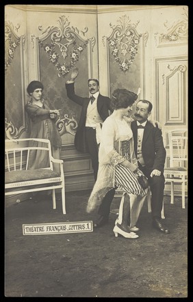 Actors performing French theatre at a prisoner of war camp in Cottbus. Photographic postcard, 191-.