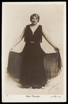 Billie Manders in character. Photographic postcard by J.A. Harding, 193-.