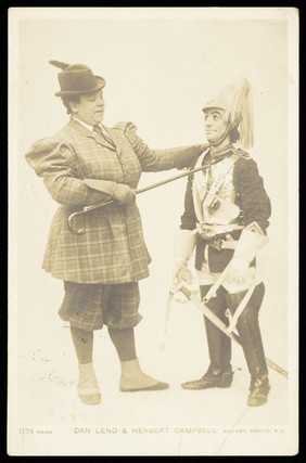 Herbert Campbell and Dan Leno in character. Photographic postcard by Hana Studios, 190-.