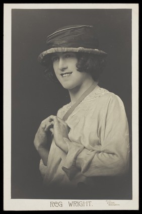 Reg Wright in drag. Photographic postcard by Dyche, 19--.