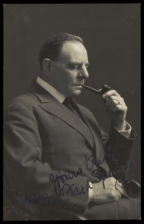 Fred Spencer smoking a pipe.