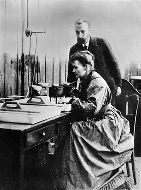 Pierre and Marie Curie at work in their laboratory.